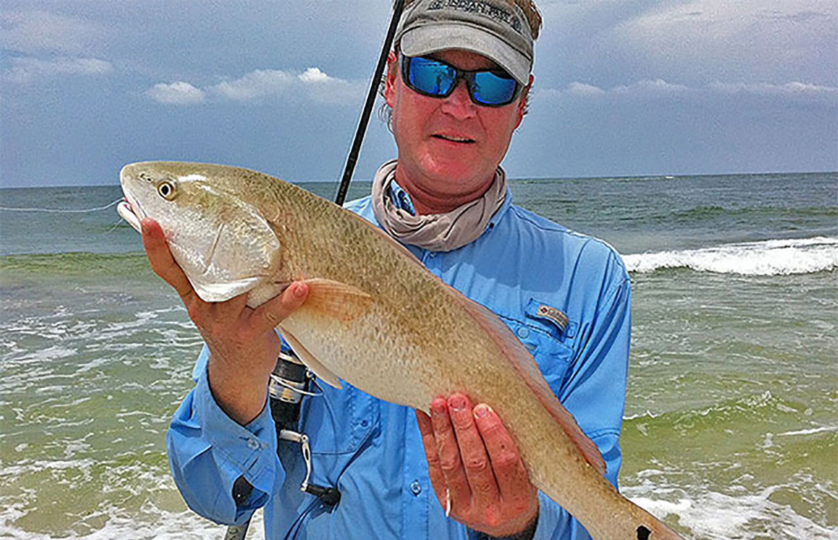 The author caught this nice slot redfish from shore. Saltwater shore fishing is simple, fun and doesn't cost an arm and a leg to get setup with the right gear. (Rob Newell photo)