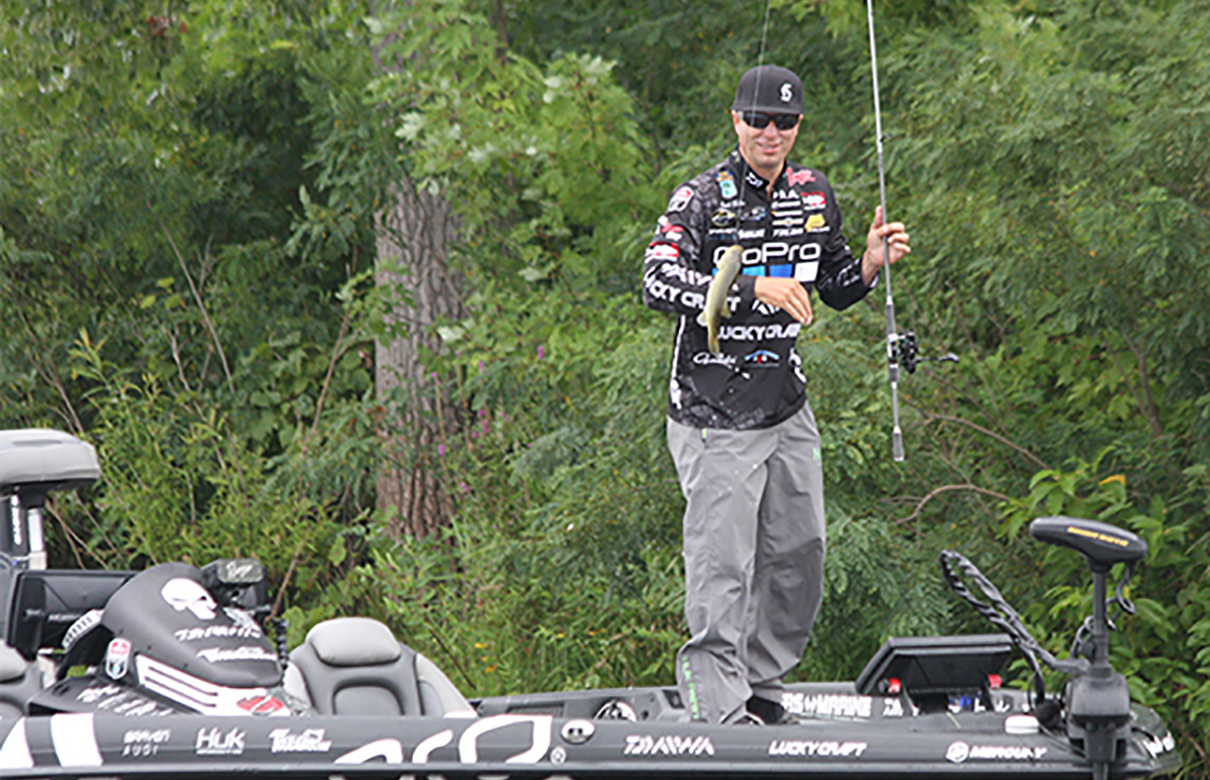 Brent Ehrler lands a Mississippi River bass on a wacky-rigged worm. (BassFan photo)