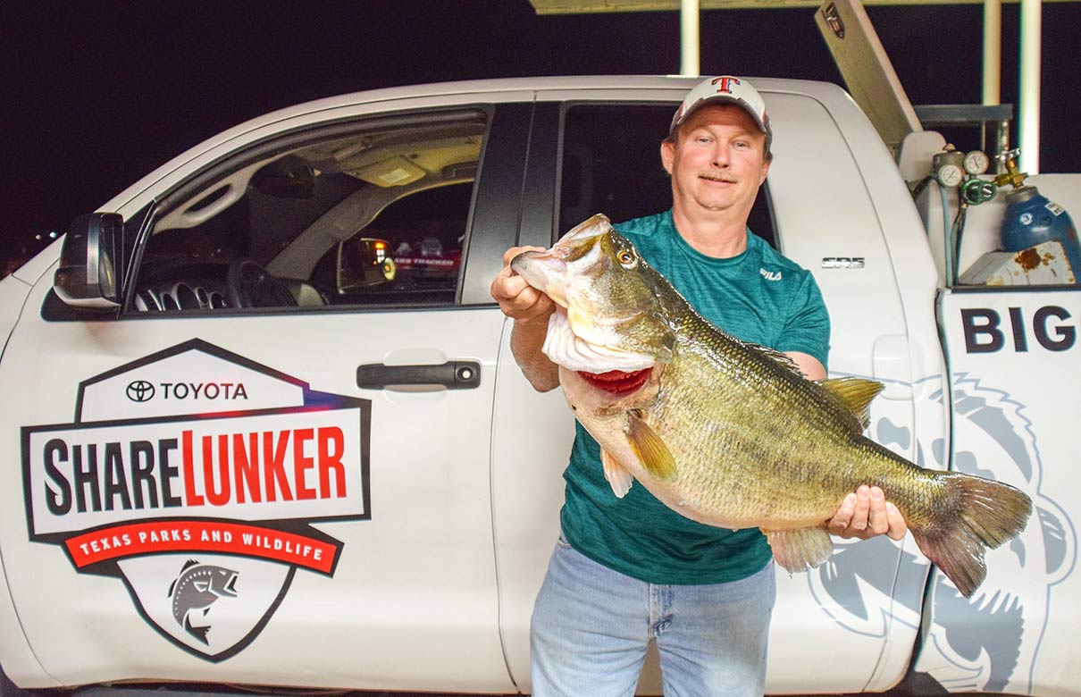 John LaBove caught the 48th biggest bass in Texas history when he tempted this 15.48-pound Lake Fork largemouth with a black-and-blue jig fished in four feet of water. (Photo courtesy of Kyle Brookshear/Texas Parks and Wildlife Department)