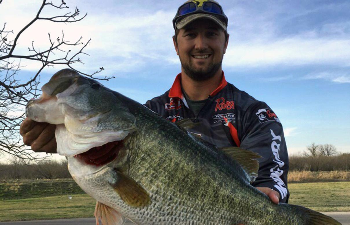 Austin Terry is pictured with the 13.40-pound largemouth he caught out of Twin Buttes Reservoir on March 14, 2018. (Photo courtesy of Texas Parks and Wildlife)