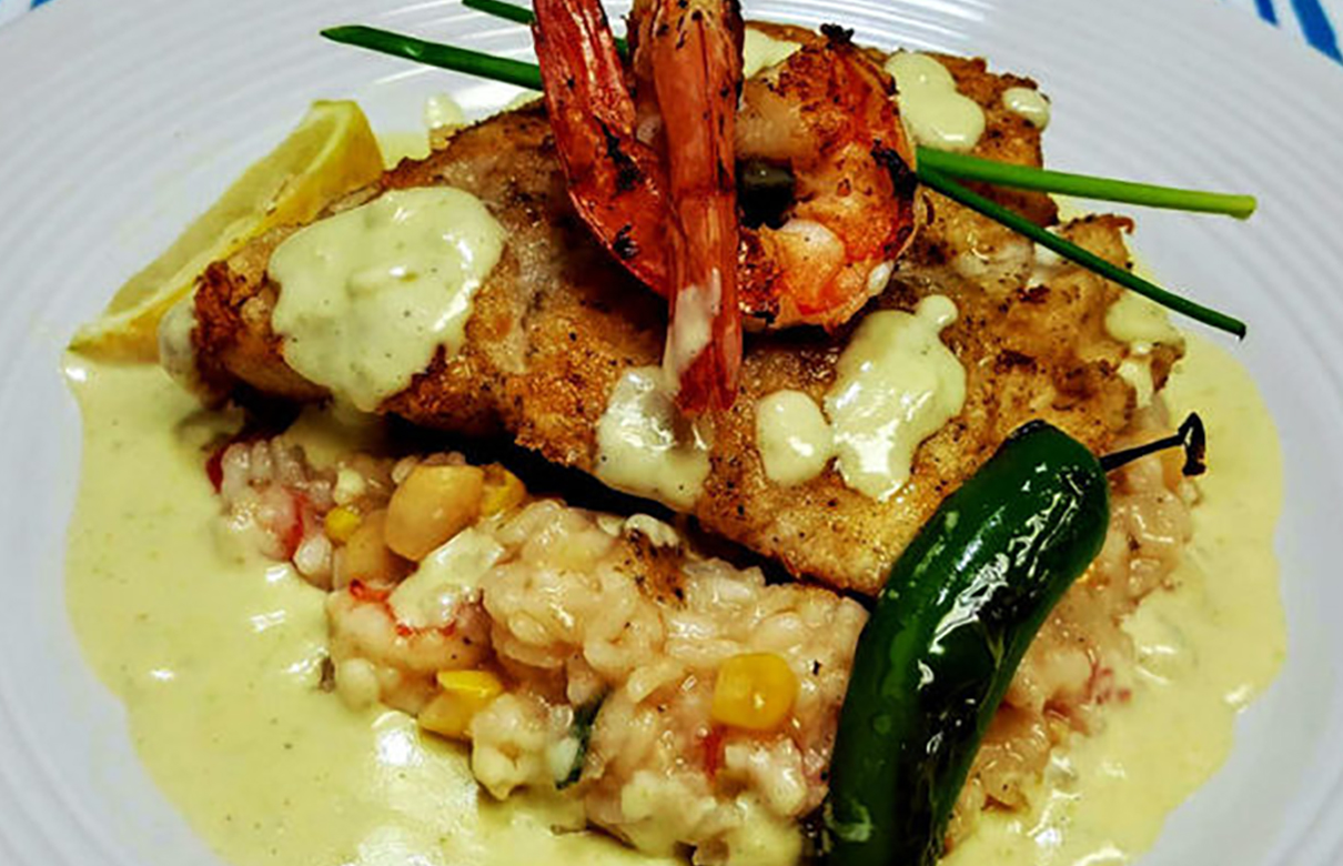 Garnish the snook recipe with jumbo shrimp, jalapeños, lemon wedges and chives. (Photo courtesy of Cheryl Benecke)