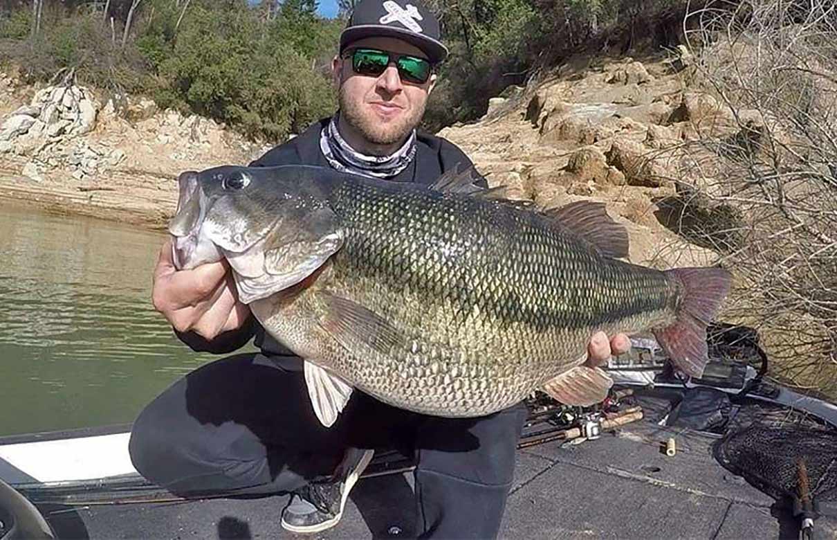 Nick Dulleck with his world record 11-pound, 4-ounce spotted bass. (Photo courtesy of Nick Dulleck)